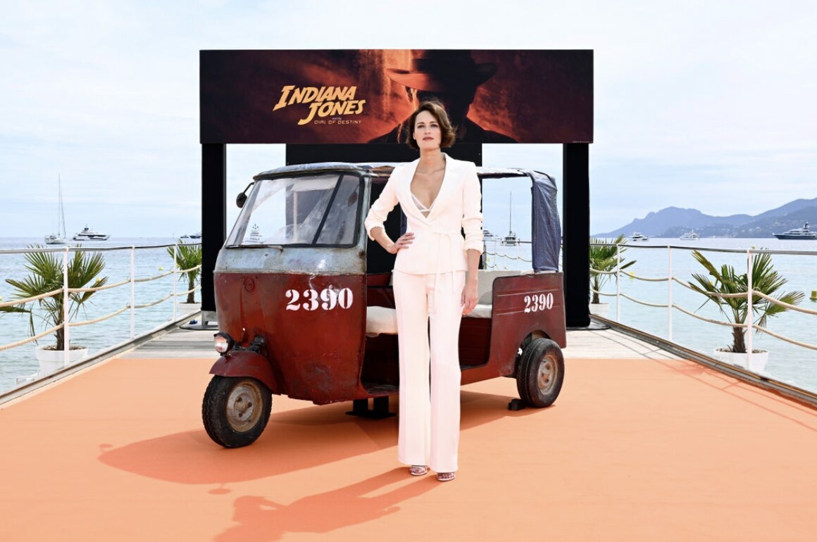 Phoebe Waller-Bridge stood in front of Tuk Tub at Indiana Jones and the Dial of Destiny Photo call in Cannes.