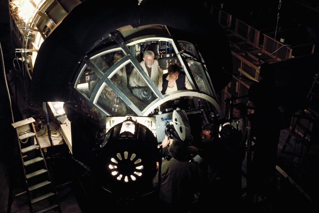 The film crew captures Han and Obi-Wan in the Falcon cockpit during the filming of Star Wars: A New Hope.