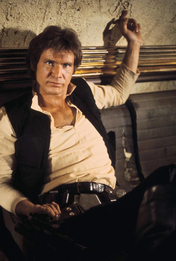 Han Solo sits in the Mos Eisley Cantina in A New Hope.