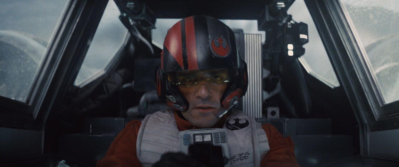Poe Dameron pilots a starfighter in Star Wars: The Force Awakens.