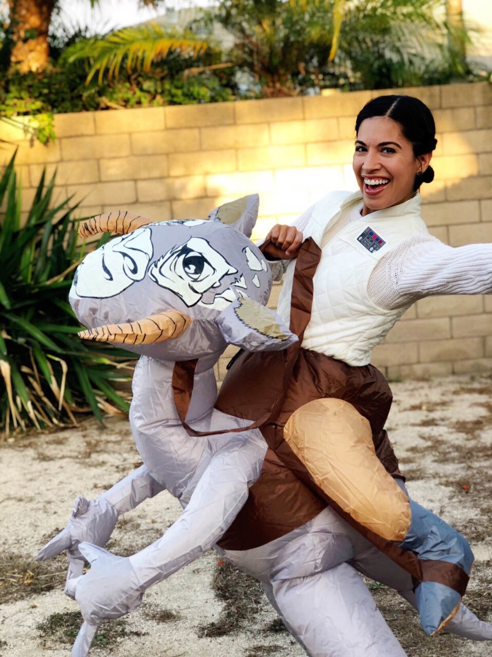 Jennifer Landa cosplays with a tauntaun.