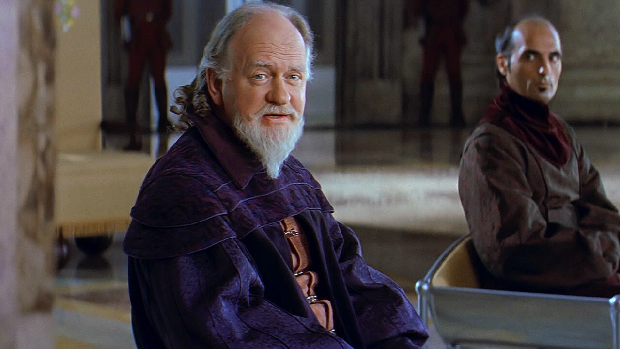 Sio Bibble sits beside fellow council member Graf Zapalo in The Phontom Menace.