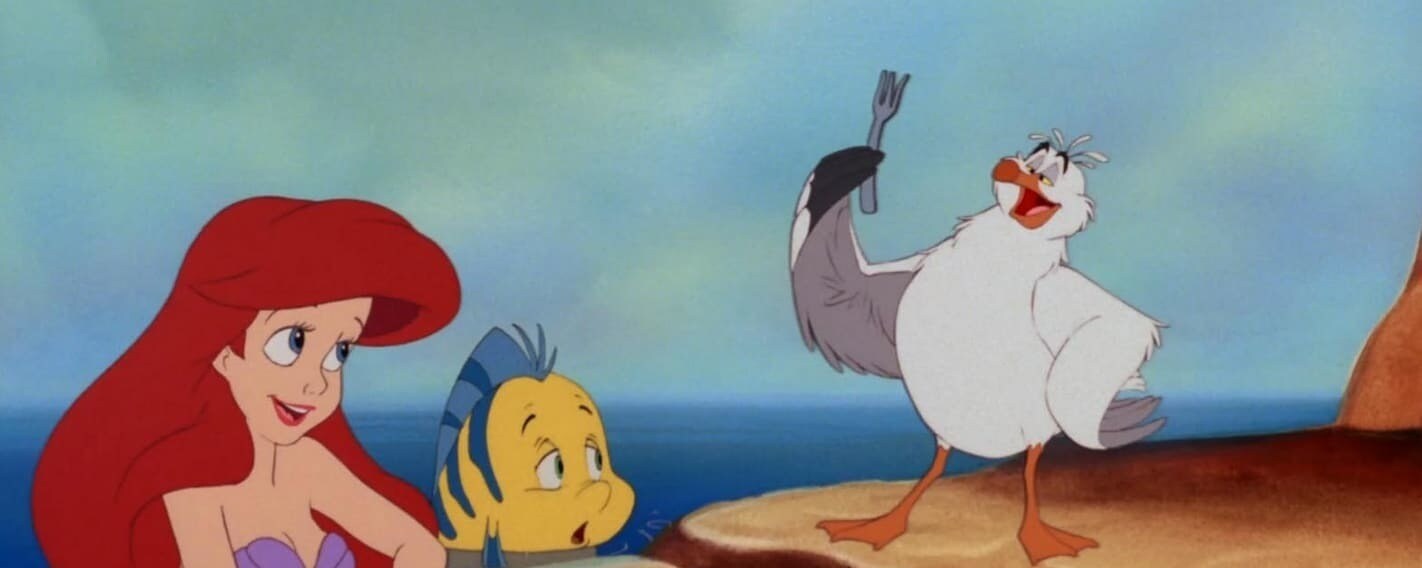 Ariel and Flounder listen to Scuttle explain the dinglehopper.