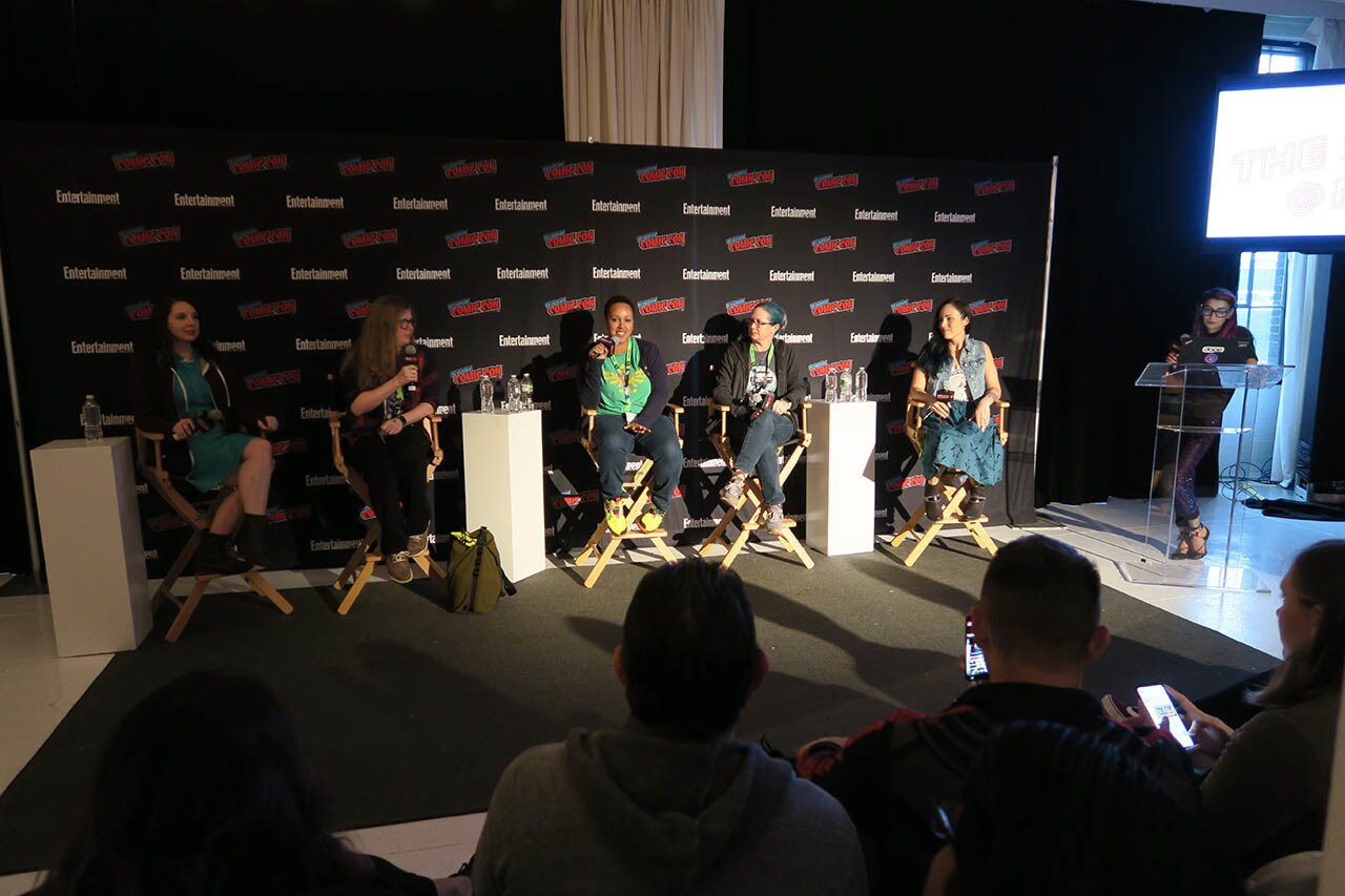 Authors are shown on a panel at NYCC 2018.