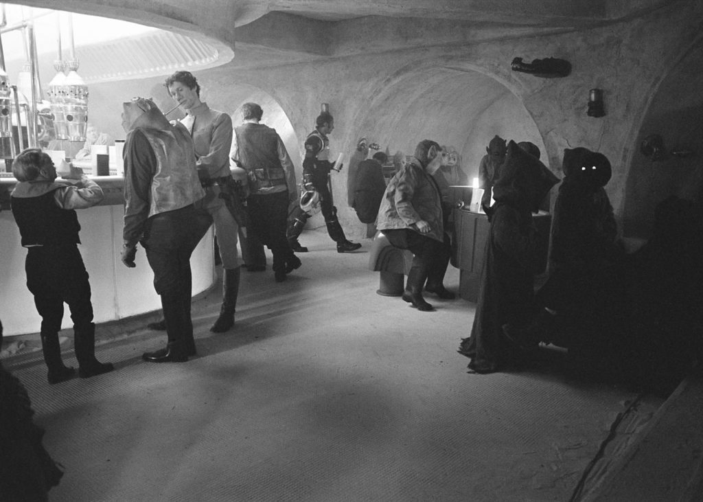 A black and white behind-the-scenes photo of The Mos Eisley Cantina from the filming of A New Hope.