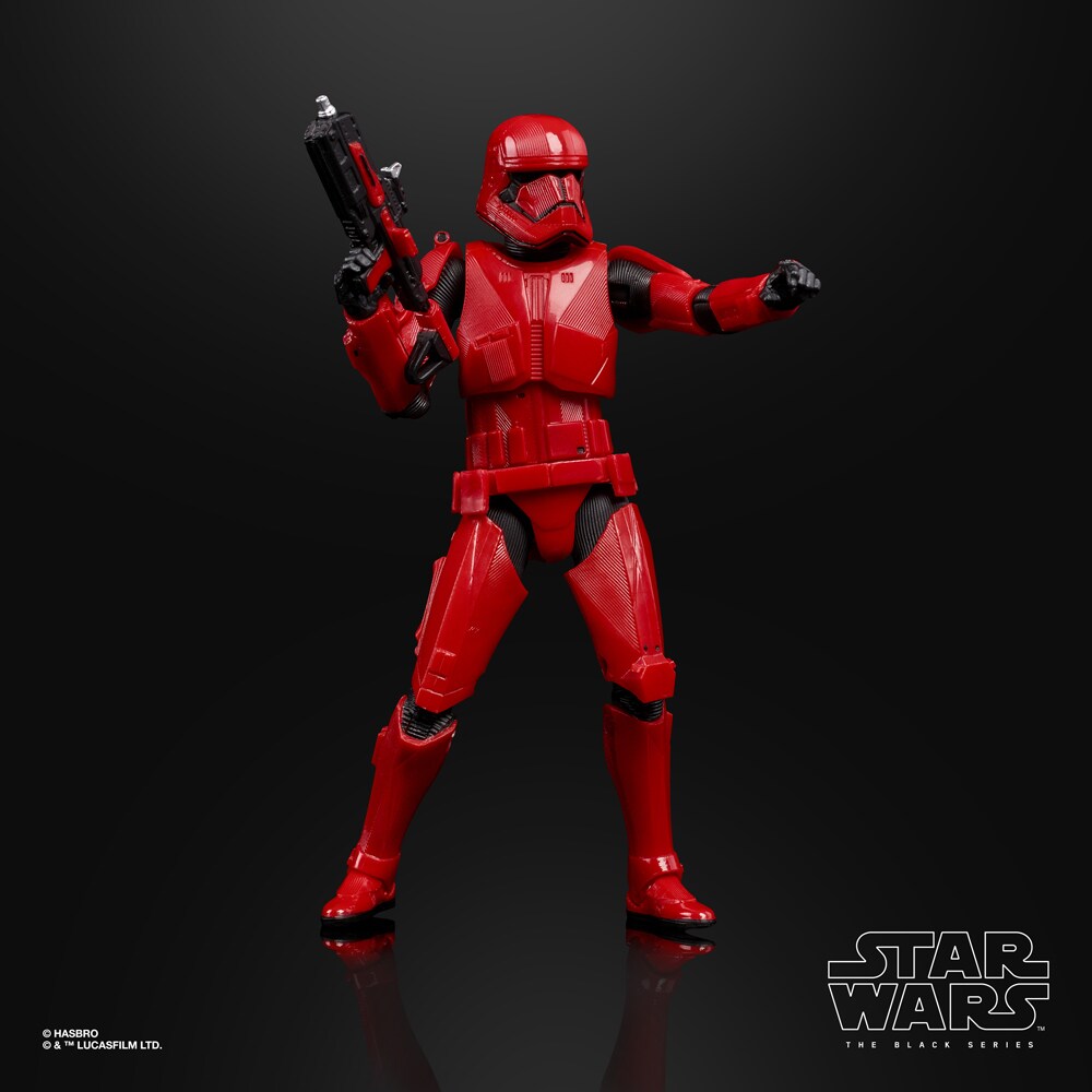 A Sith trooper action figure holds a blaster in one hand and points with the other.
