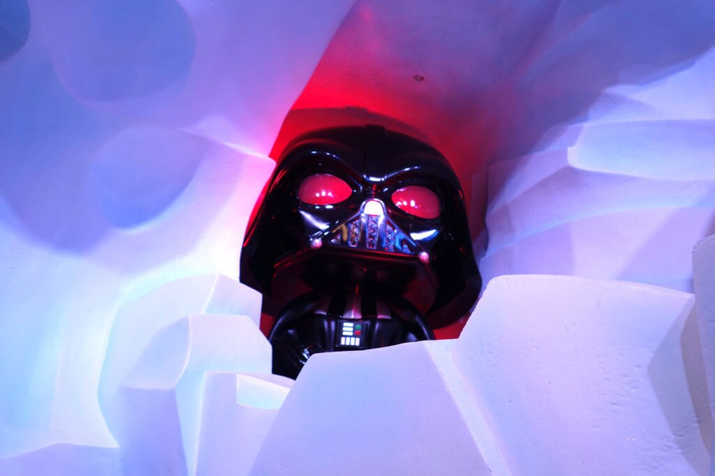 A Funko Pop! Darth Vader helmet with red eyes.