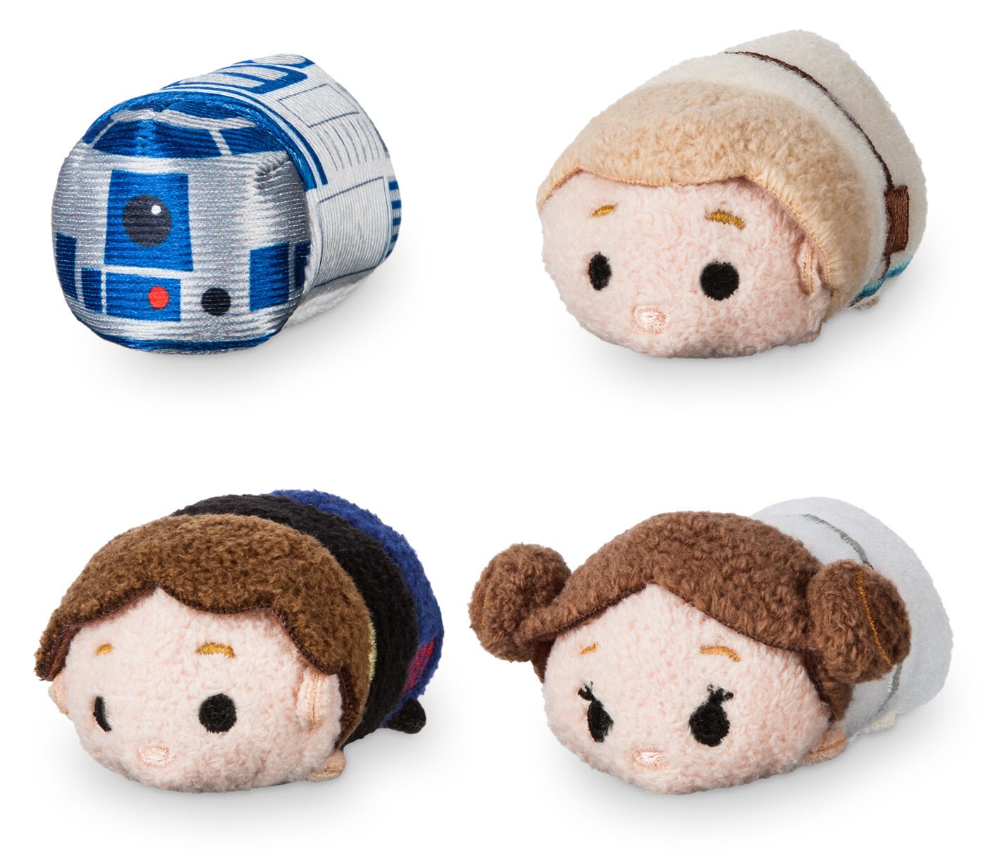 Plush toys of R2-D2, Luke, Han, and Leia.