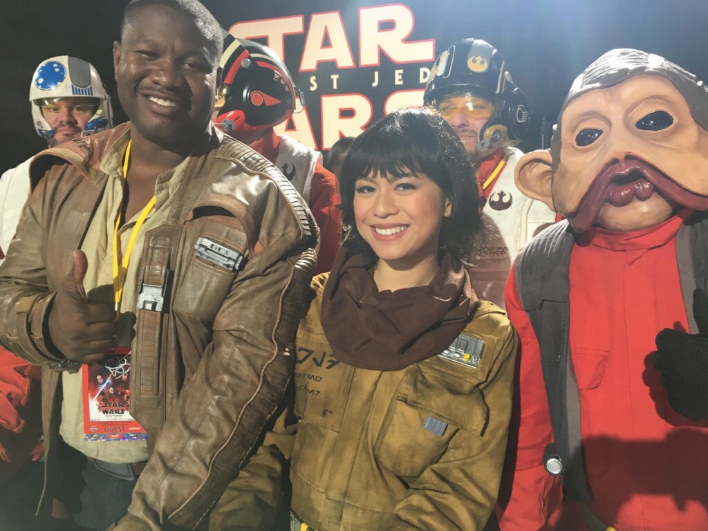 Star Wars fans cosplay as Finn, Rose, and Nien Nunb.