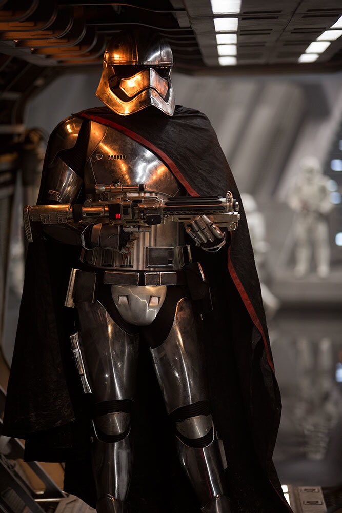 Captain Phasma holds a blaster rifle in The Force Awakens.