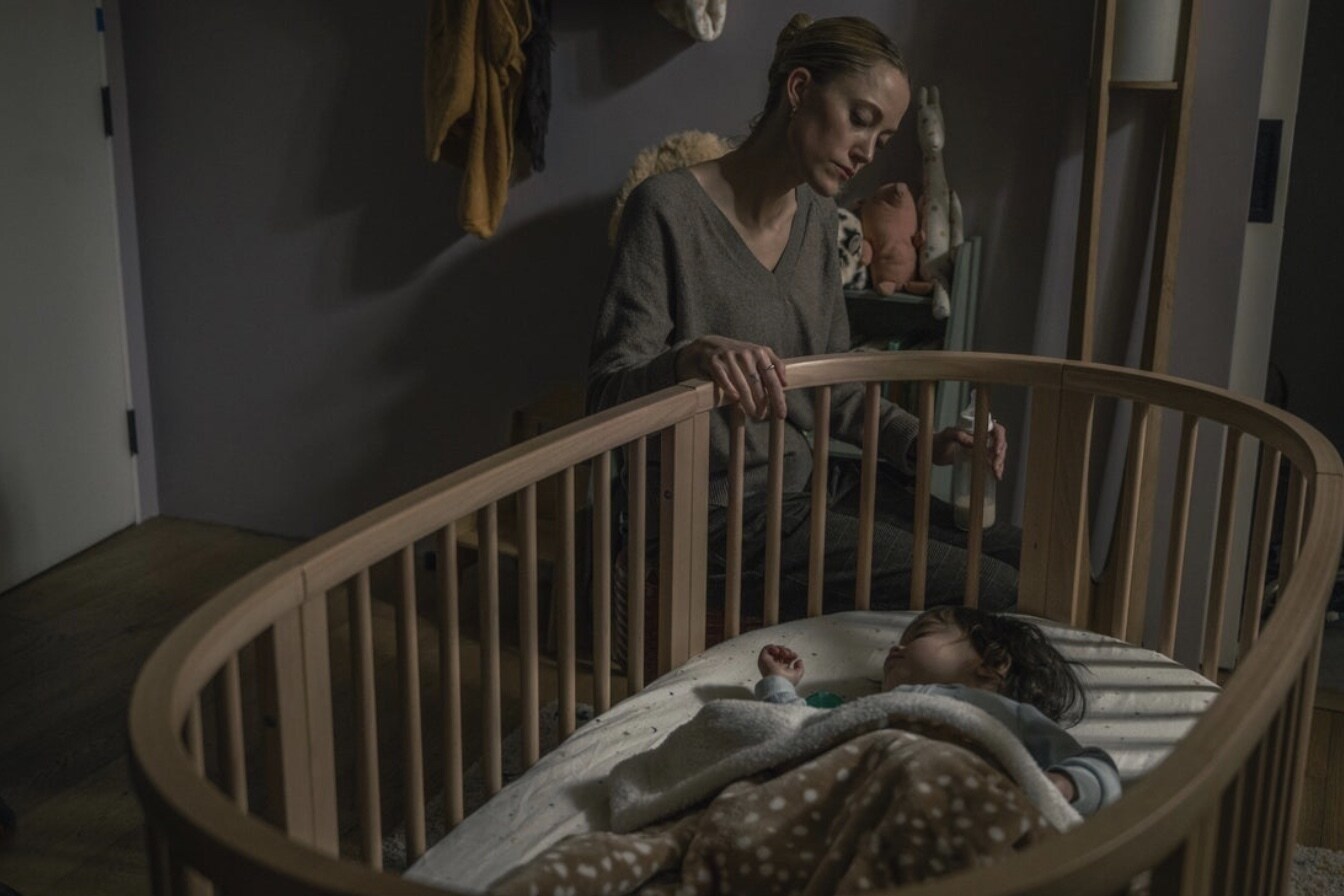 The Hand That Rocks the Cradle Logos and Key Art Film Still