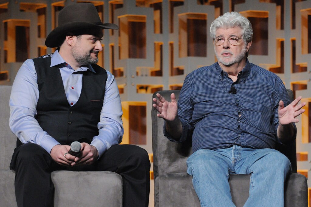 George Lucas and Dave Filoni sit on stage at Star Wars Celebration Orlando's 40 Years of Star Wars panel.