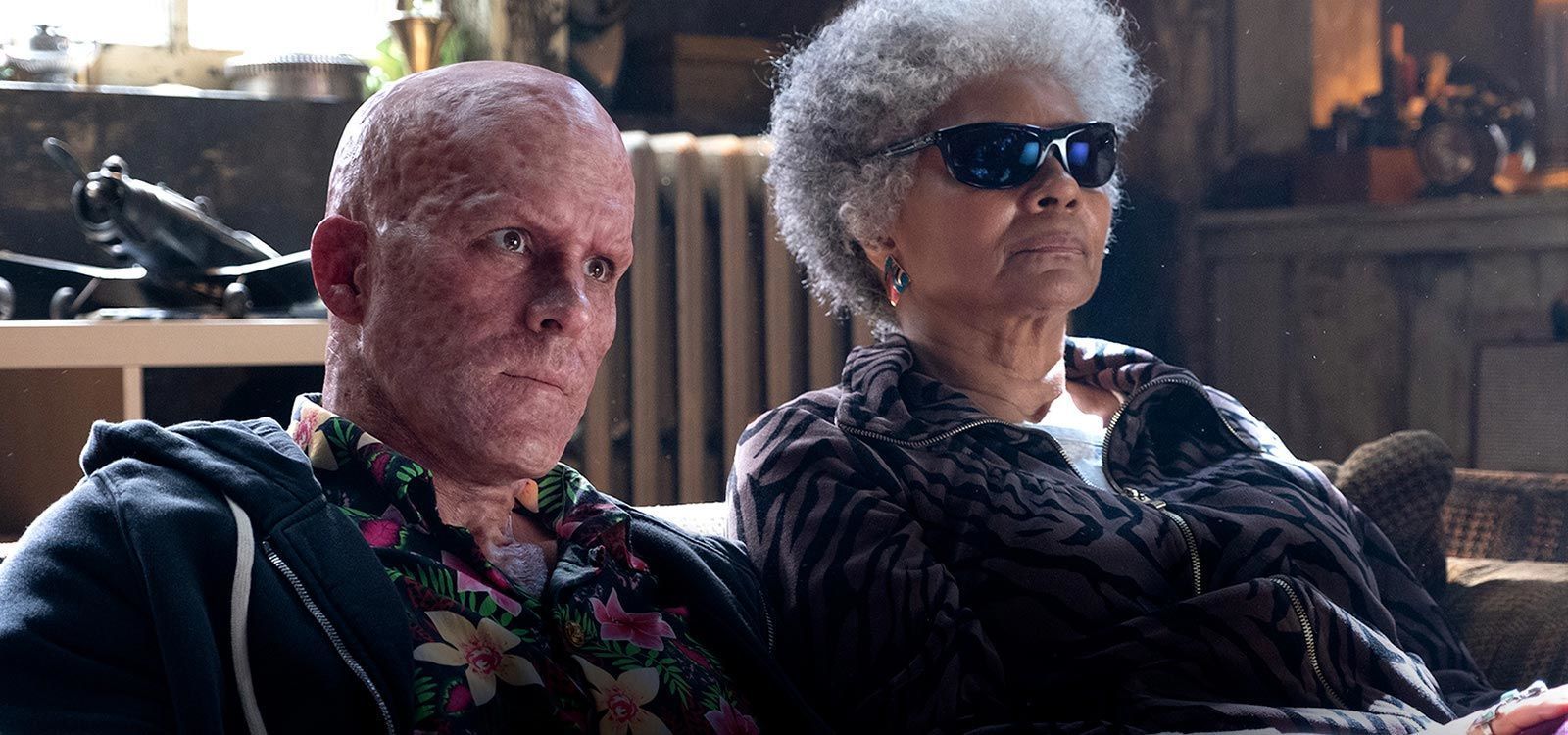 Actors Ryan Reynolds (as Deadpool) and Leslie Uggams	 (as Blind Al) sitting together in the film "Deadpool 2"