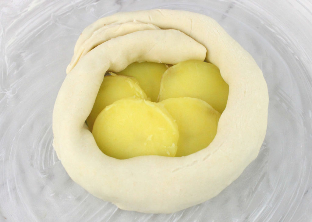 Dough wrapped around slices of potato.