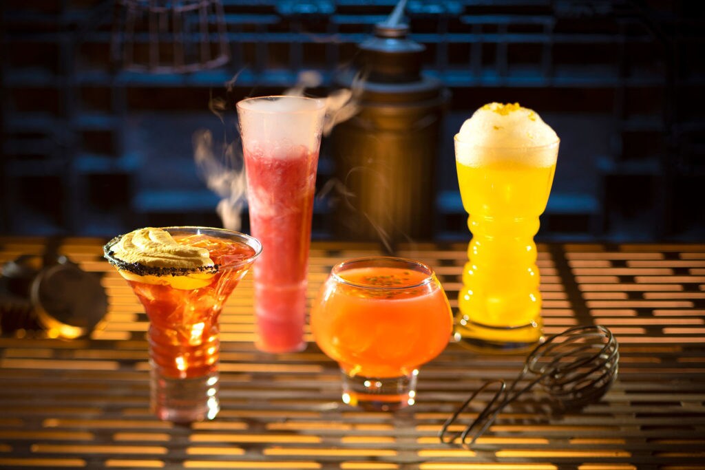 From left to right, alcoholic beverages: The Outer Rim, Bespin Fizz, Yub Nub, and Fuzzy Tauntaun can be found at Oga’s Cantina inside Star Wars: Galaxy’s Edge. (Kent Phillips/Disney Parks)