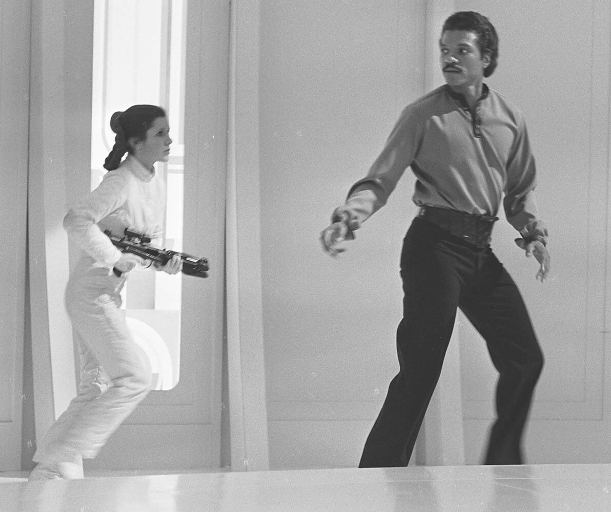 Lando Calrissian and Leia running through Cloud City behind the scenes in The Empire Strikes Back