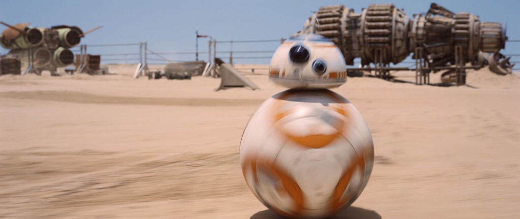 BB-8 rolls along the sand on Jakku.