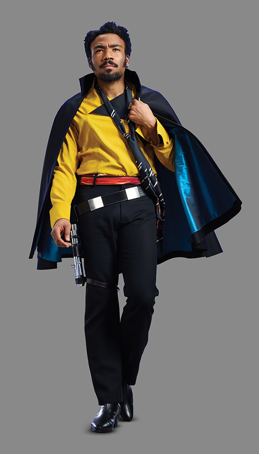 Lando walks while clutching the side of his cape.