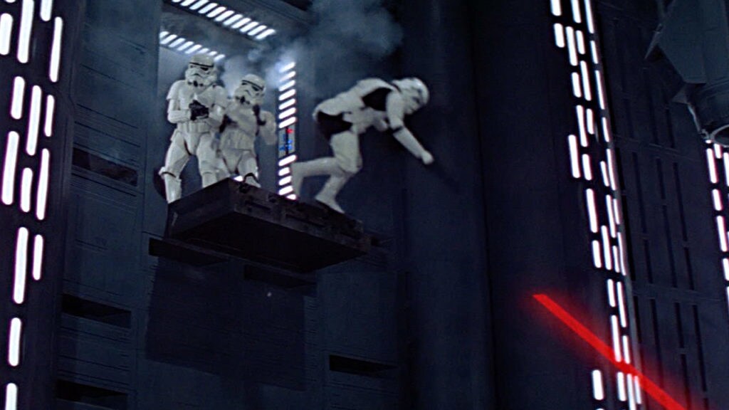 A stormtrooper falls from a bridge inside the Death Star.
