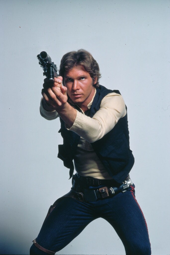 Han Solo wields his DL-44 heavy blaster pistol in a studio photo for A New Hope.