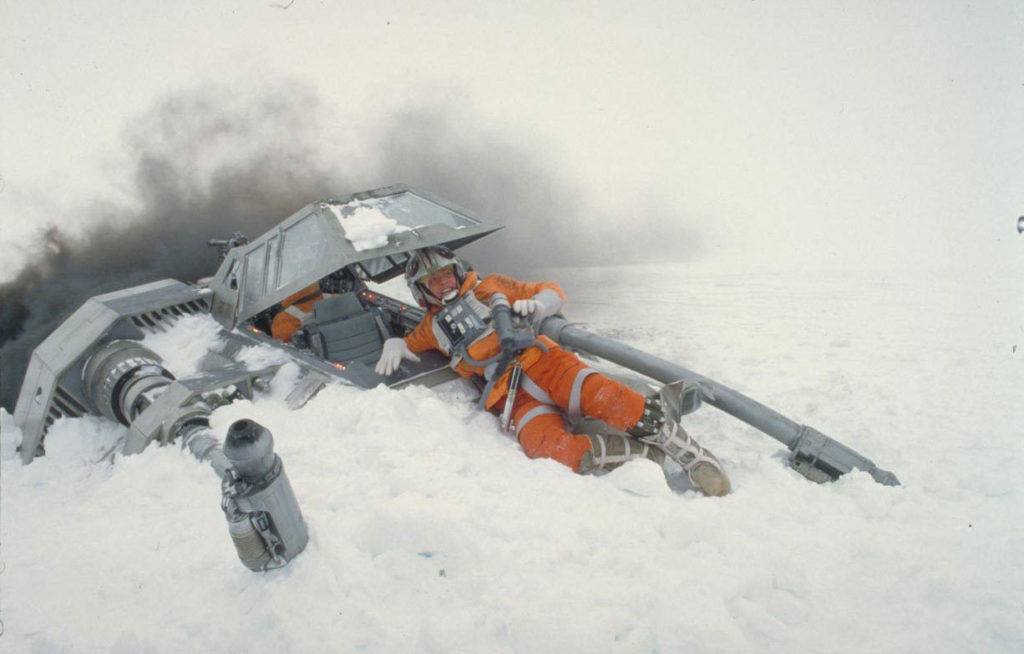 Luke Skywalker lies on the front of his crashed snowspeeder in The Empire Strikes Back.