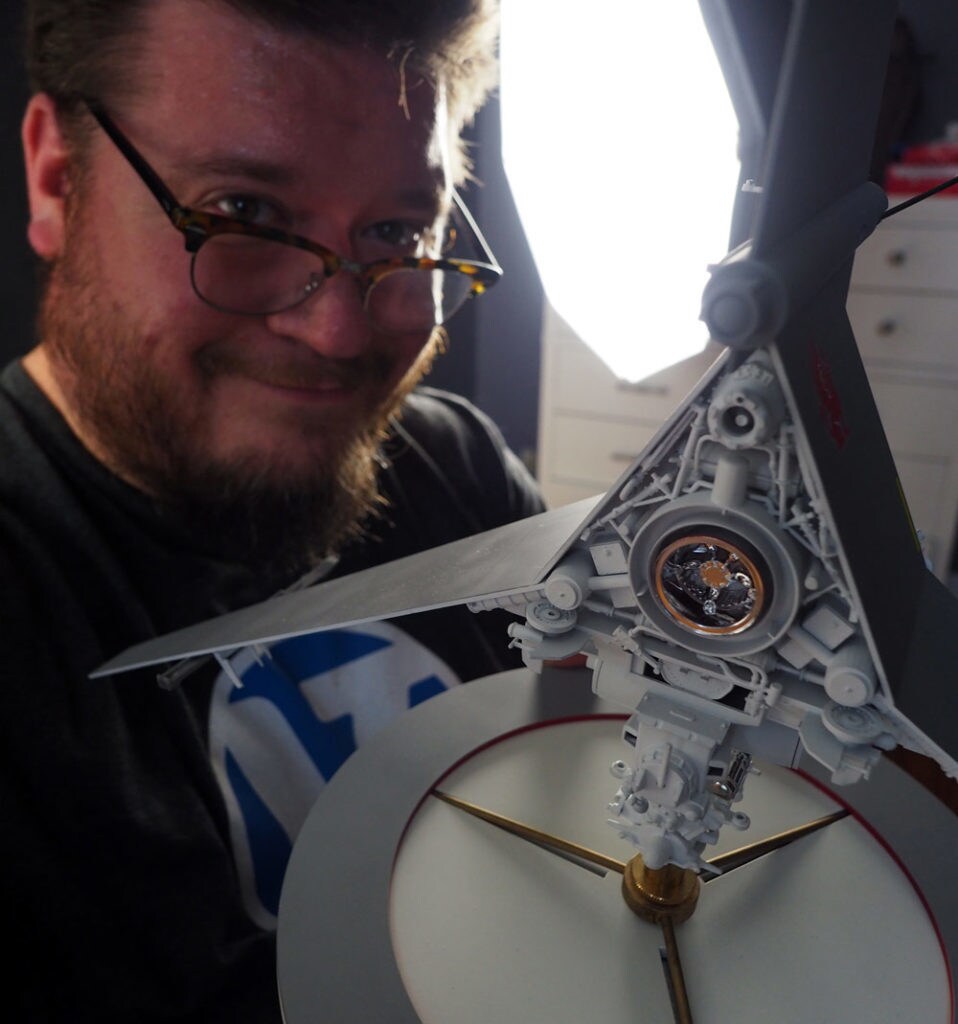 Star Wars fan Jason Eaton poses with his model of Luke Skywalker's T-16 Skyhopper.