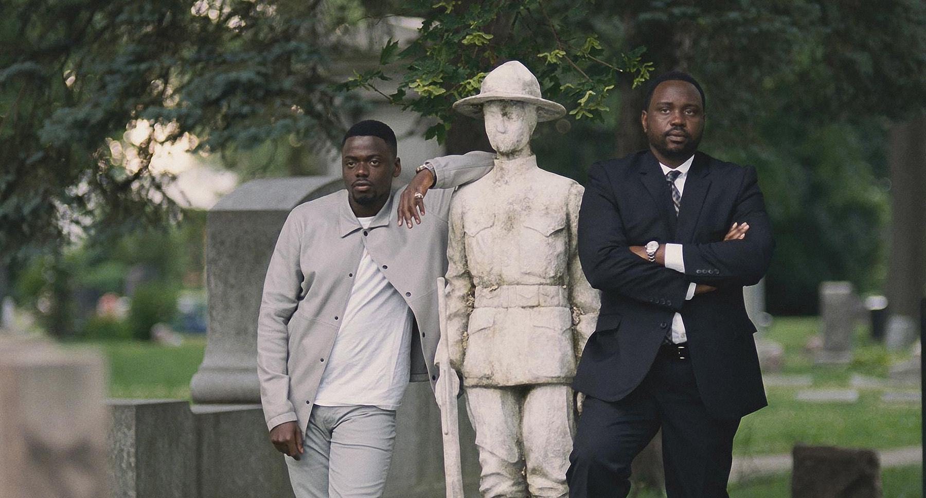 Daniel Kaluuya and Brian Tyree Henry next to a statue in "Widows"