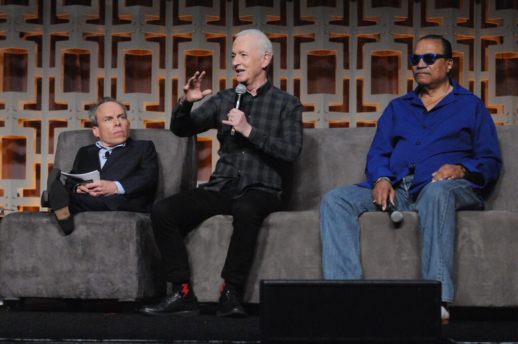 Actors Anthony Daniels, Warwick Davis, and Billy Dee Williams speak at a panel at Star Wars Celebration Orlando in 2017.