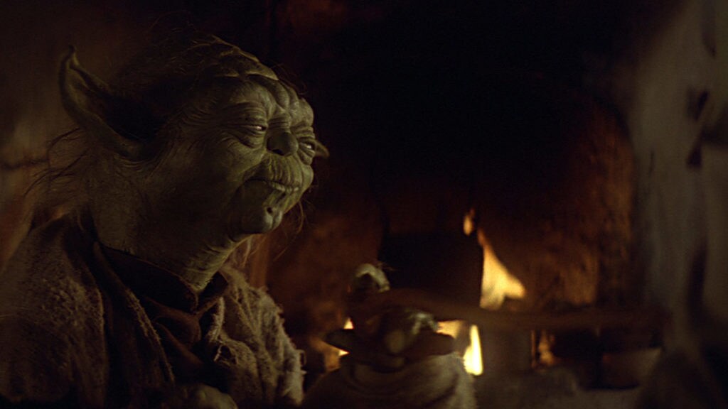 Yoda in front of the fire from Star Wars: Return of the Jedi.