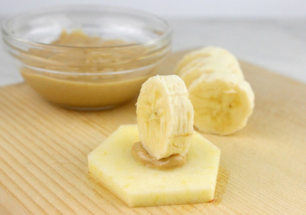 Banana and apple slices making the wing of a Fruit TIE Fighter