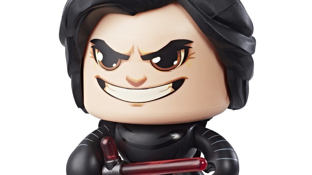 A Kylo Ren Star Wars Mighty Muggs collectible figure holds a lightsaber.