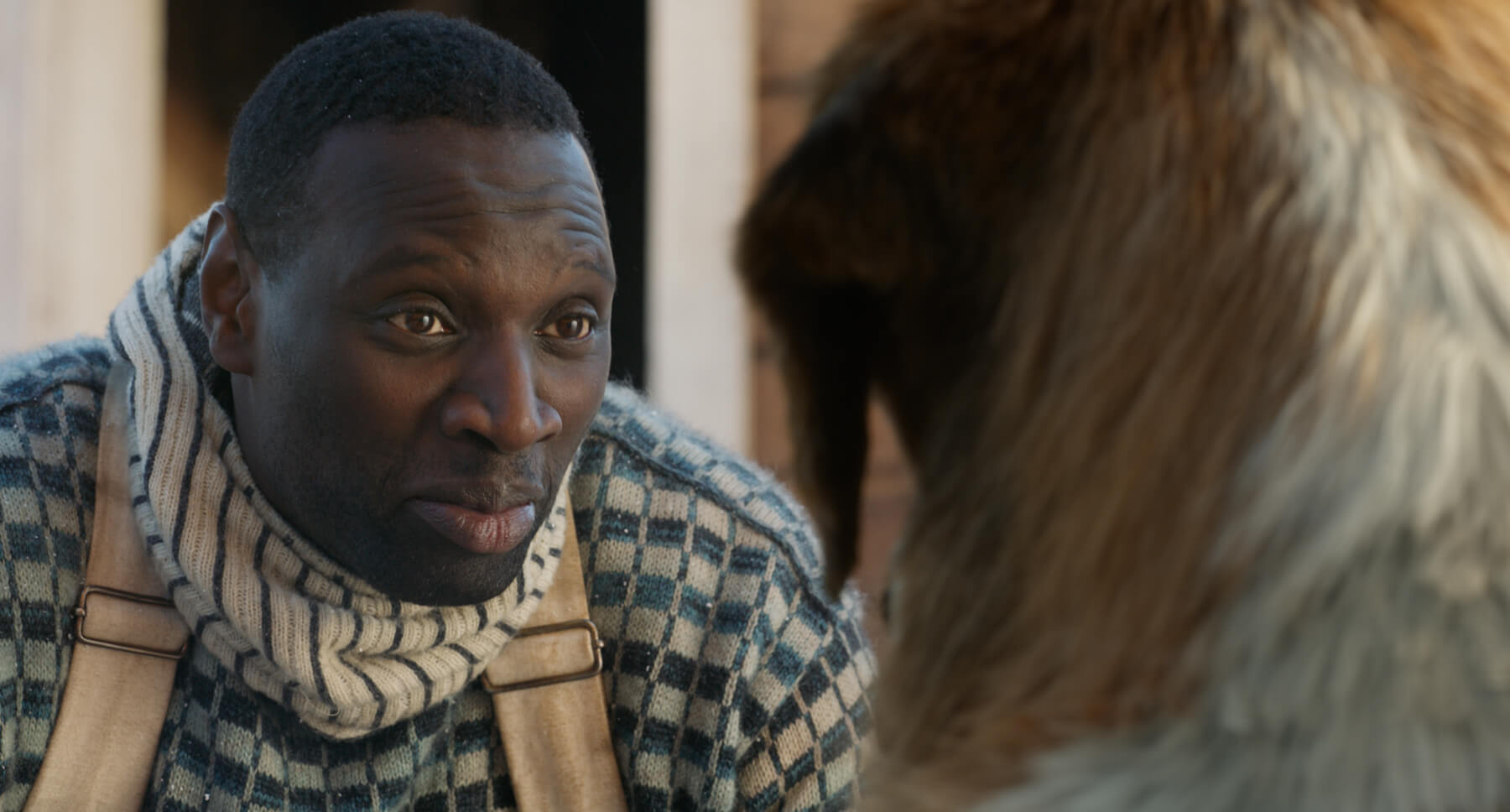 Actor Omar Sy (as Perrault) with Buck, the dog from the movie "The Call of the Wild"