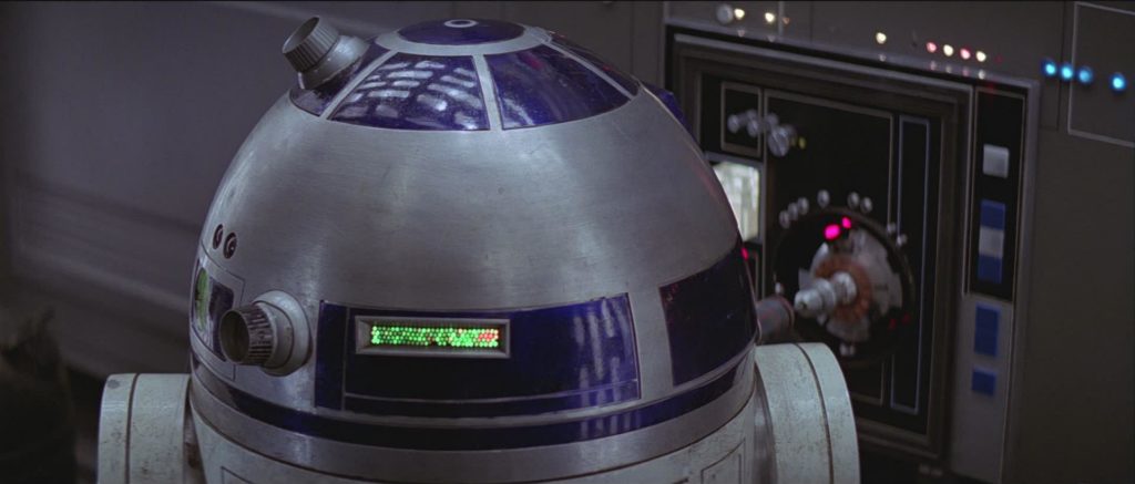 R2-D2 connects to a computer panel.
