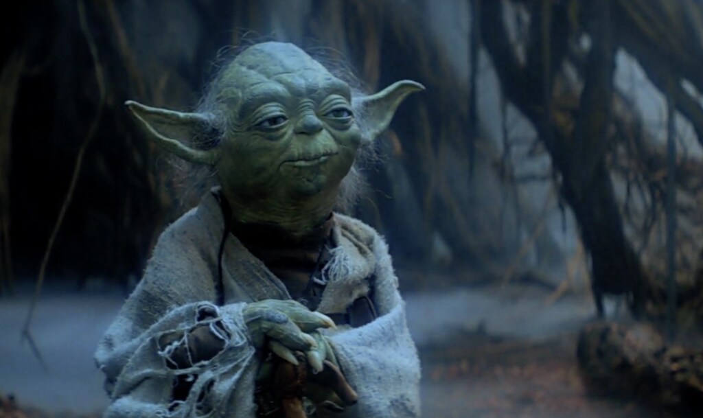 Yoda stands amid the swampy surroundings of Dagobah in The Empire Strikes Back.