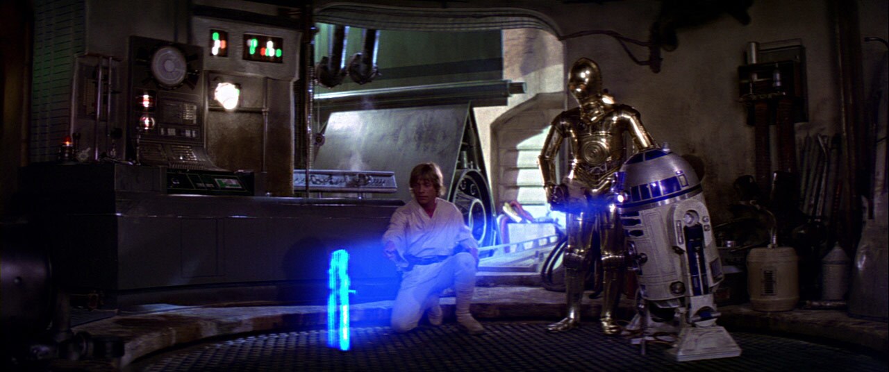 R2-D2 projects a hologram of Princess Leia for Luke and C-P3O.