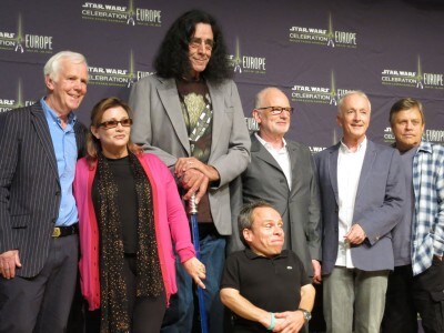 The cast of the original Star Wars poses at a convention.