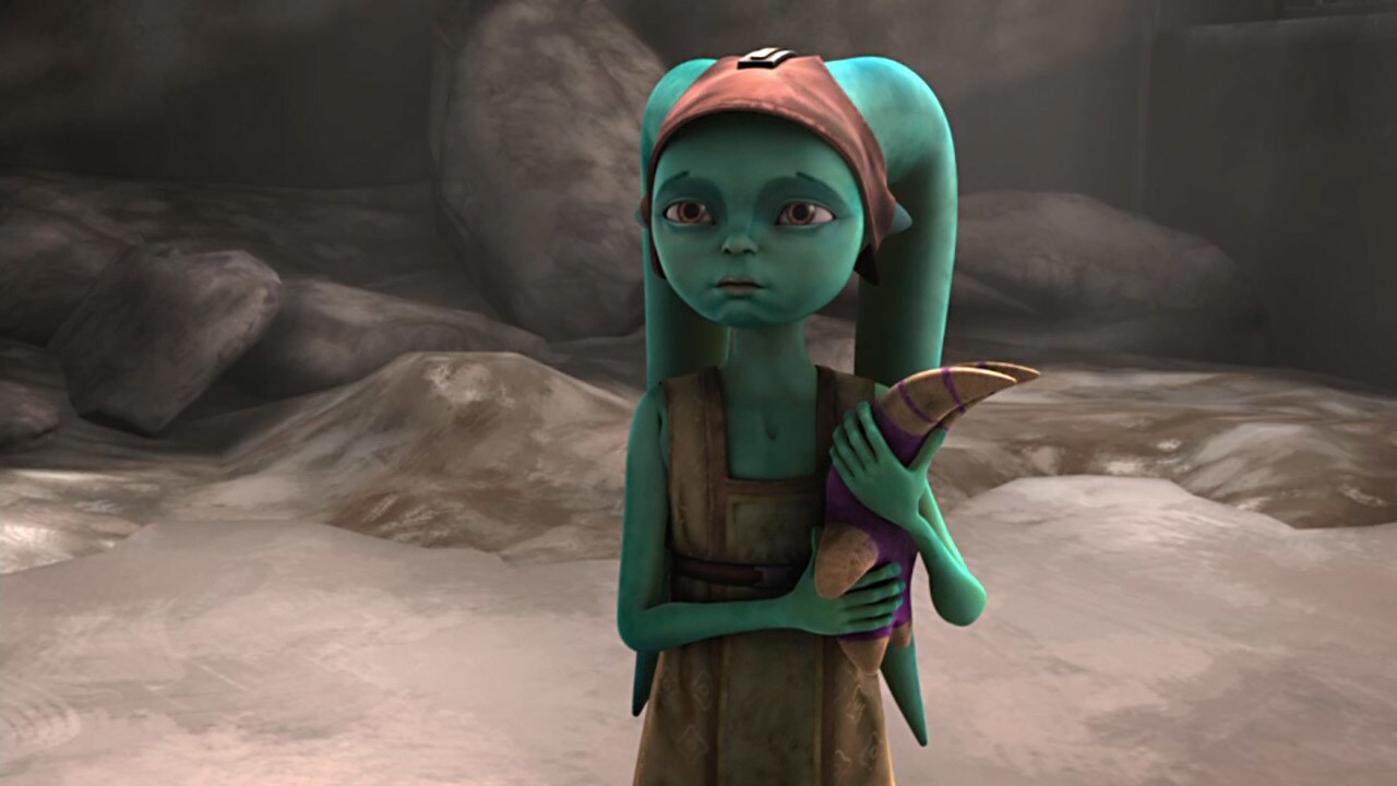 A young Twi'lek girl clutches a toy.