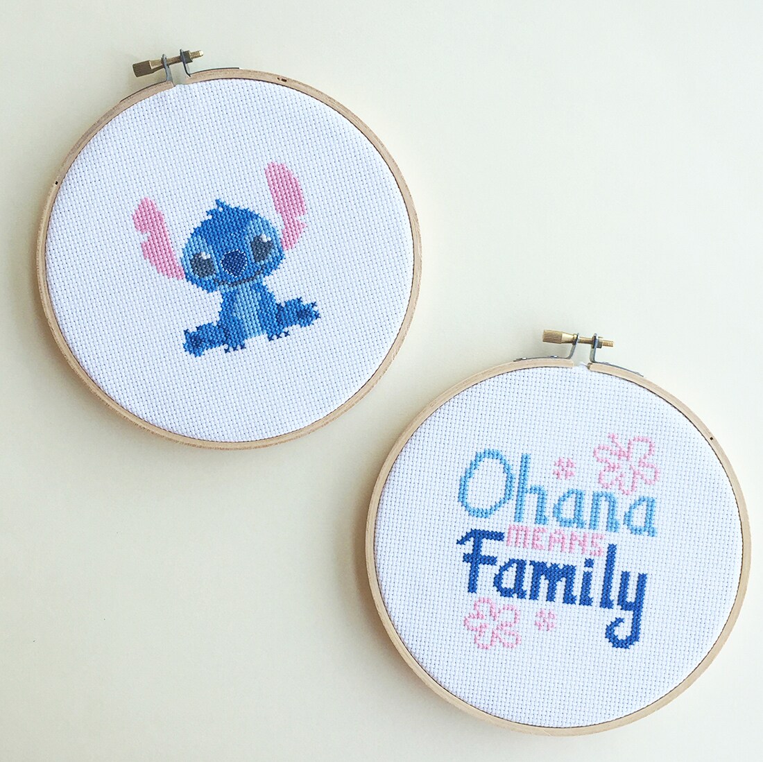 Two small cross stitch projects, one of Stitch from Lilo & Stitch and another that says "Ohana means Family".