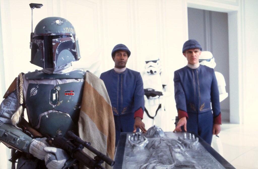 Boba Fett escorts Han encased in carbonite in The Empire Strikes Back.