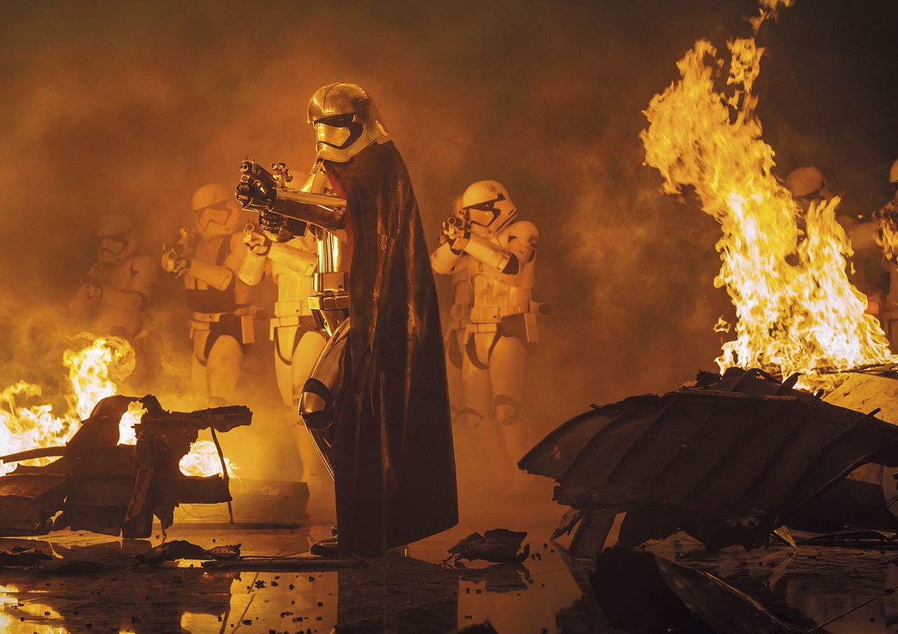 Captain Phasma surrounded by stormtroopers and fire