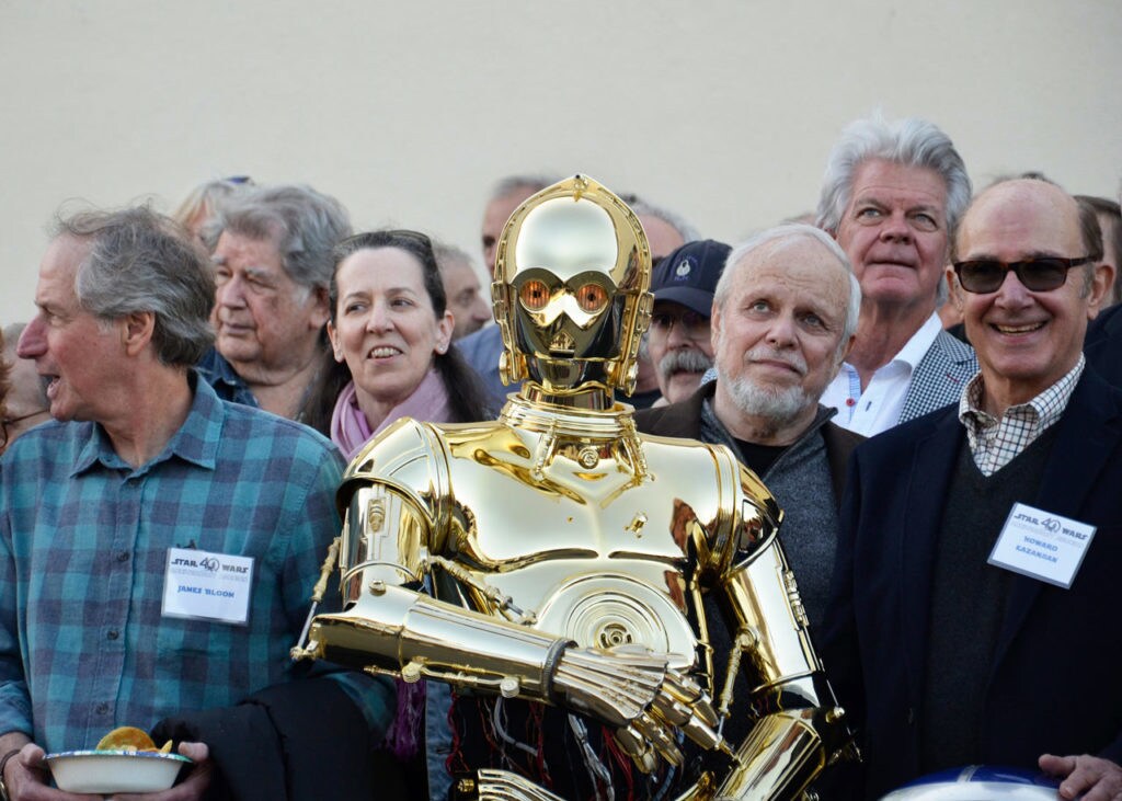 Former ILM workers pose with C-3PO.