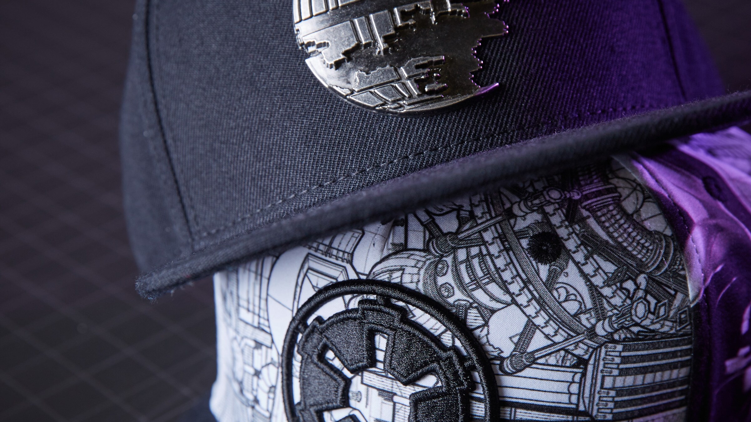 Hats decorated with Death Star and Imperial logo art.