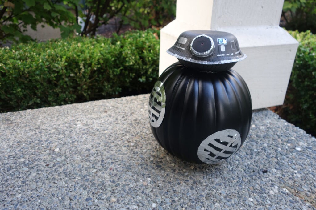 A pumpkin decorated to look like BB-9E.