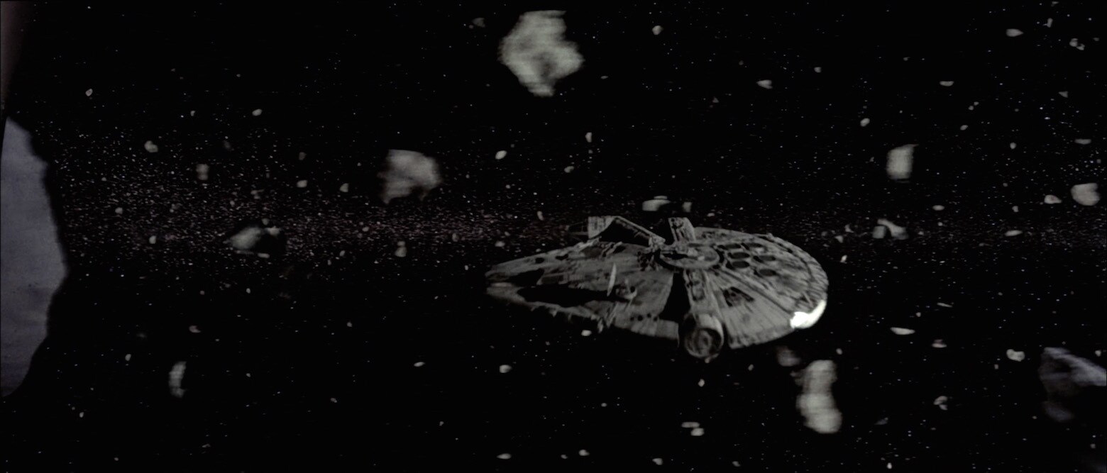 The Millennium Falcon flies through an asteroid field in The Empire Strikes Back.