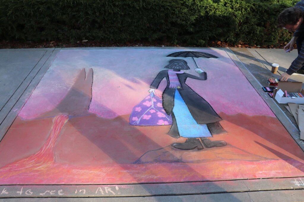 Sidewalk chalk art features Darth Vader dressed as Mary Poppins on Mustafar.