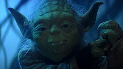 Yoda clutches his walking stick on Dagobah in The Empire Strikes Back.