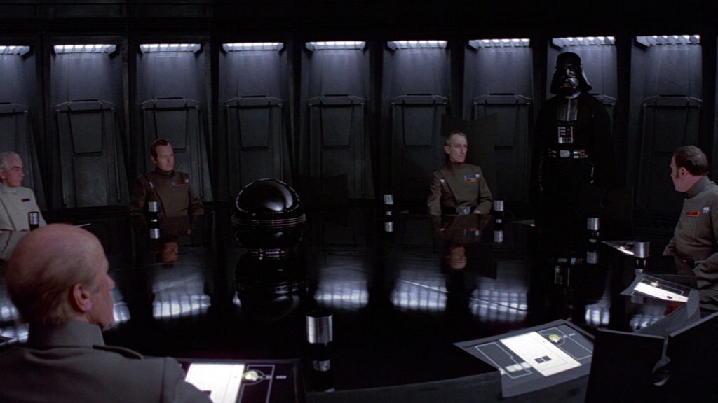 Darth Vader leads a meeting of Empire commanders onboard the Death Star.