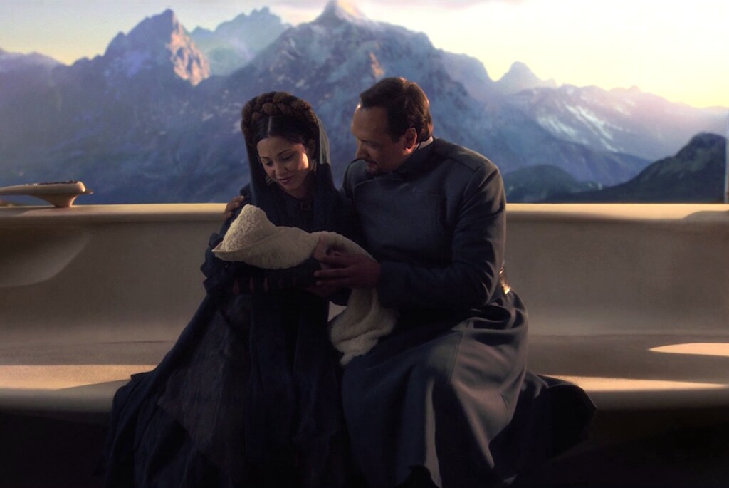 Breha and Bail Organa hold baby Leia.