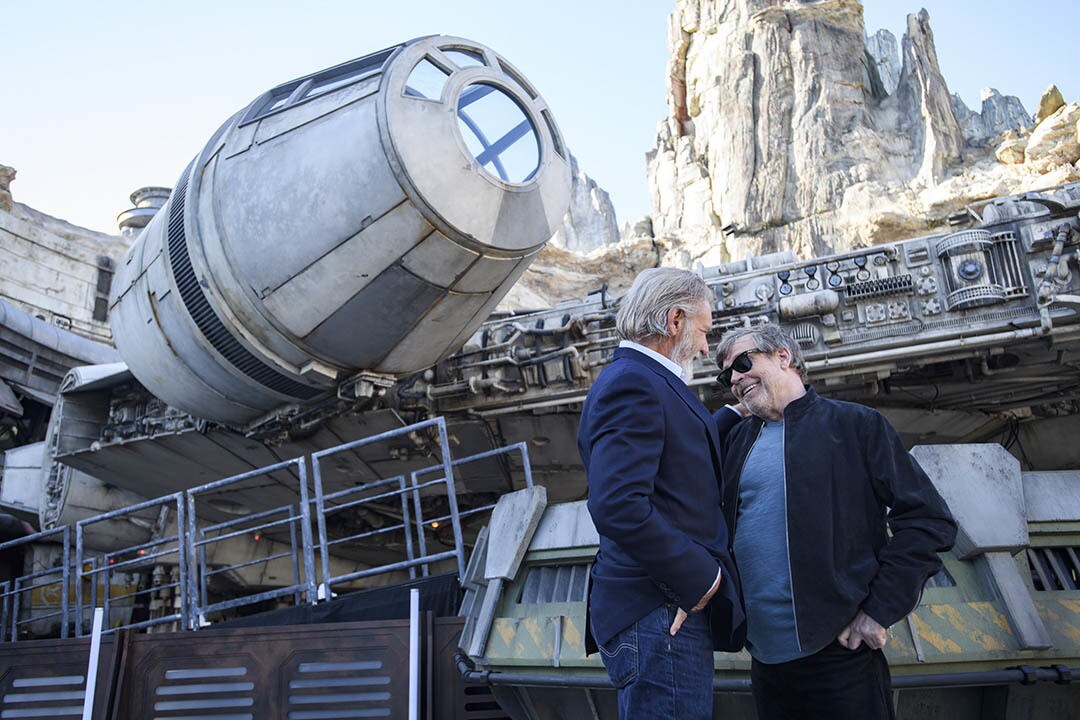 Actors Harrison Ford and Mark Hamill pose in front of the Millennium Falcon at Star Wars: Galaxy’s Edge at Disneyland Park May 29, 2019. (Richard Harbaugh/Disneyland Resort)