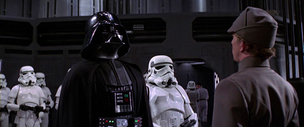 Darth Vader stands with stormtroopers behind him in A New Hope.